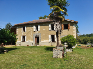 Réhabilitation d'une ancienne ferme en terre et galets